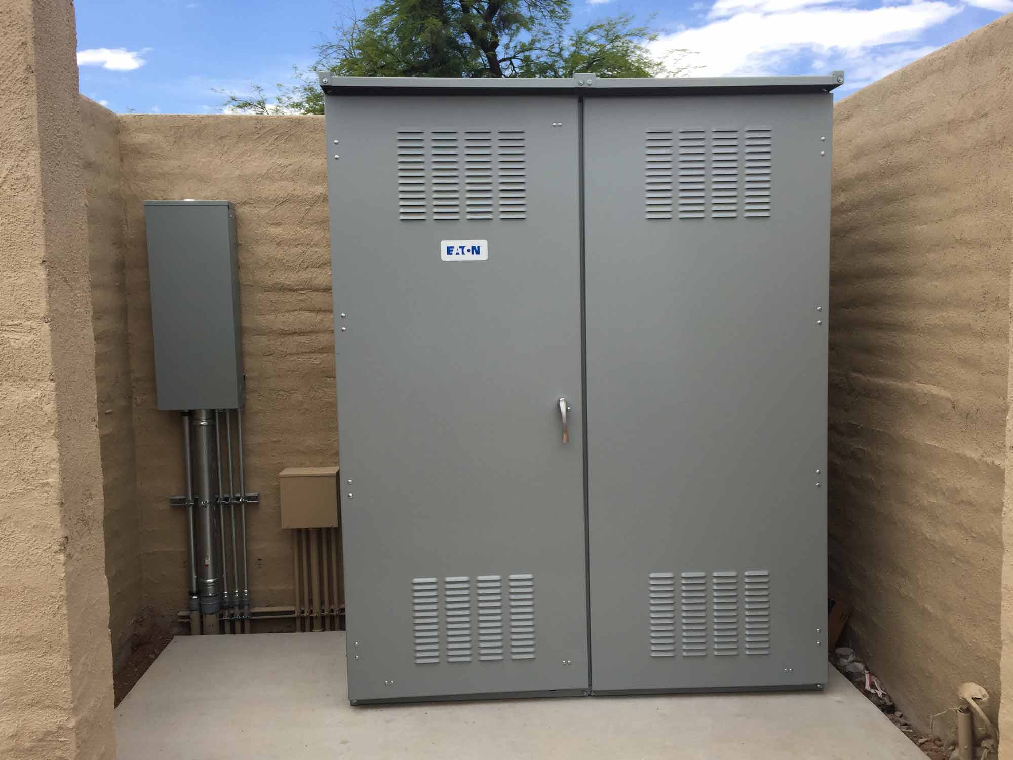 A large metal cabinet sitting in the middle of a patio.